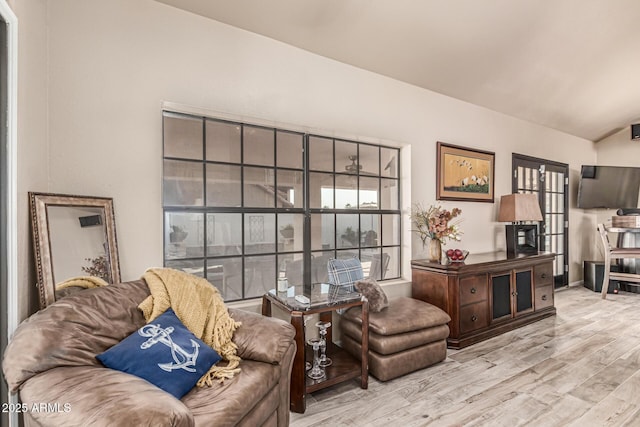 6133 E Saddleback St, Mesa, AZ 85215 - living room featuring wood finished floors and vaulted ceiling