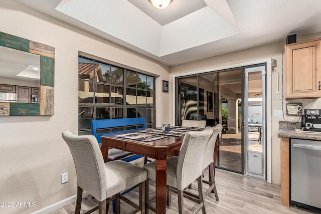 6133 E Saddleback St, Mesa, AZ 85215 - dining space with light wood-style floors