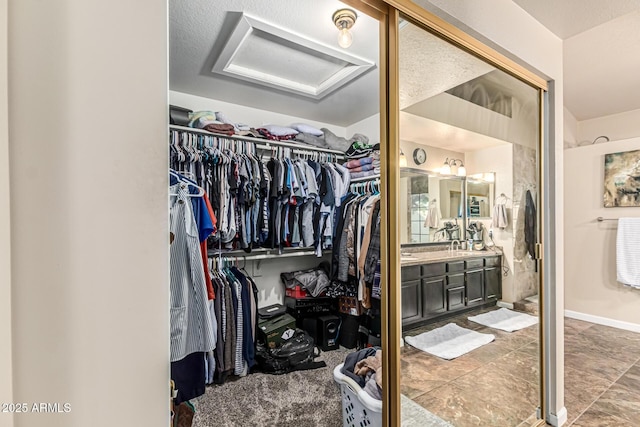 6133 E Saddleback St, Mesa, AZ 85215 - walk in closet with attic access and a sink