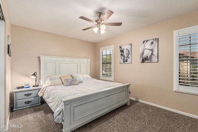6133 E Saddleback St, Mesa, AZ 85215 - bedroom featuring dark colored carpet, ceiling fan, and baseboards