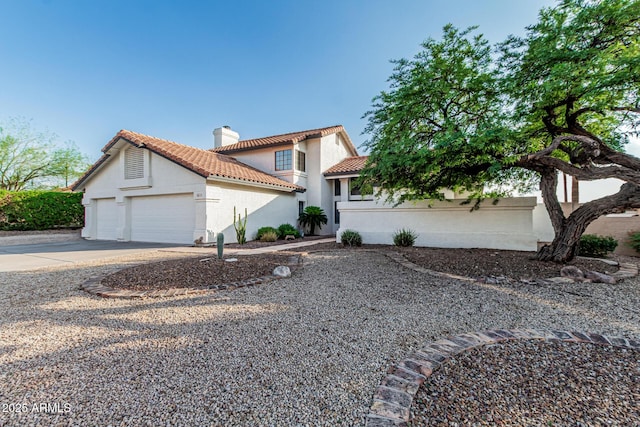 6133 E Saddleback St, Mesa, AZ 85215 - mediterranean / spanish-style home featuring a tiled roof, concrete driveway, a garage, stucco siding, and a chimney