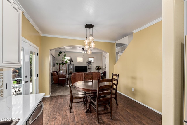 dining space with french doors, dark hardwood / wood-style flooring, and ornamental molding