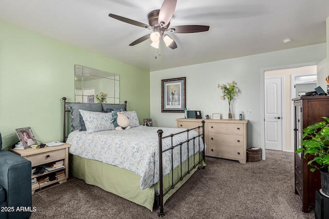 bedroom with ceiling fan and dark colored carpet