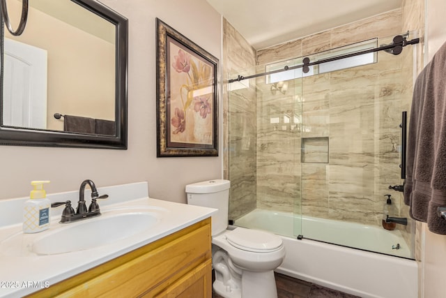 full bathroom with vanity, toilet, and combined bath / shower with glass door