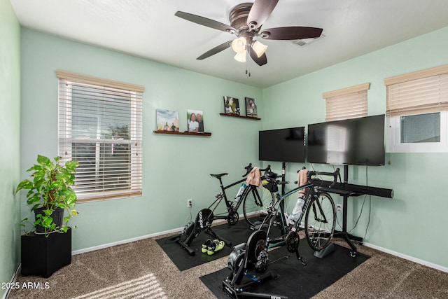 exercise room featuring ceiling fan and carpet floors