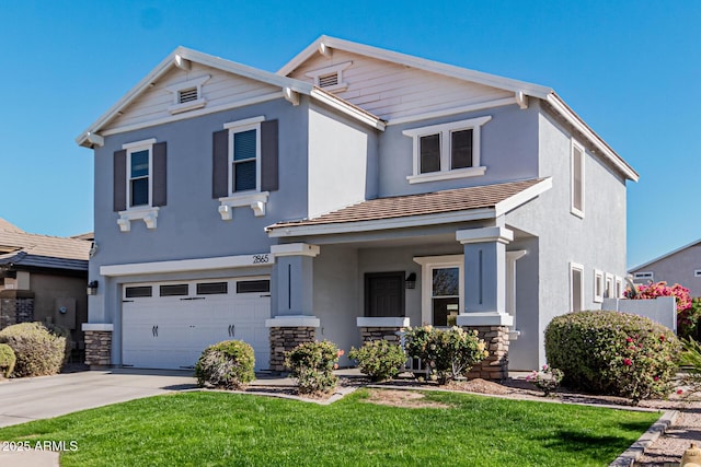 view of front facade featuring a garage and a front lawn