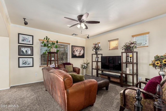 carpeted living room featuring ceiling fan and crown molding