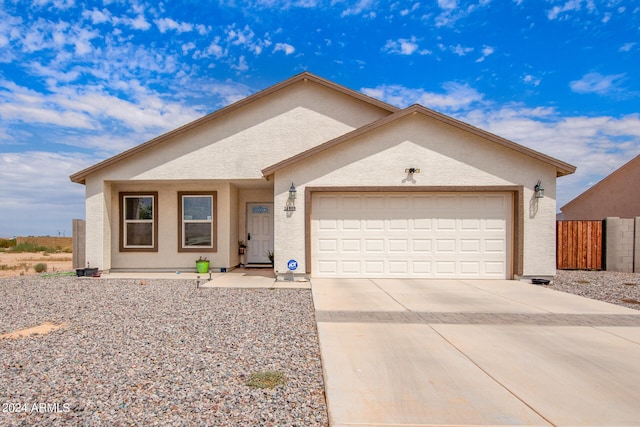 ranch-style house featuring a garage