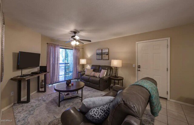 living room with ceiling fan and light tile floors