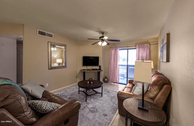 tiled living room with ceiling fan