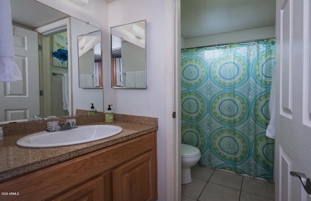 bathroom featuring tile floors, toilet, and vanity