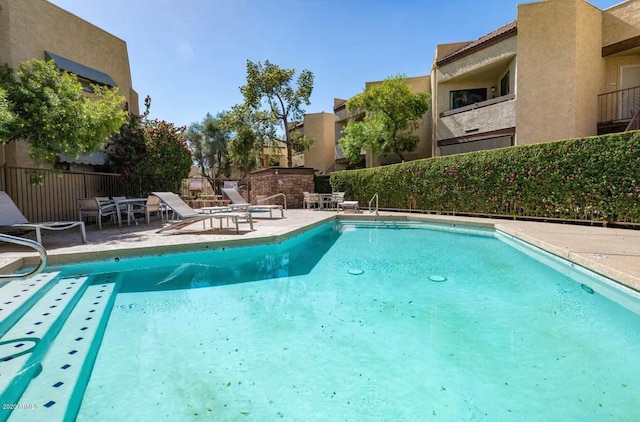 view of pool featuring a patio area