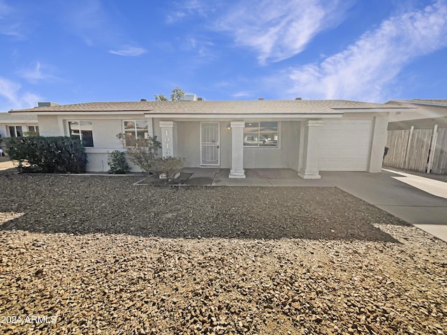 ranch-style house featuring a garage