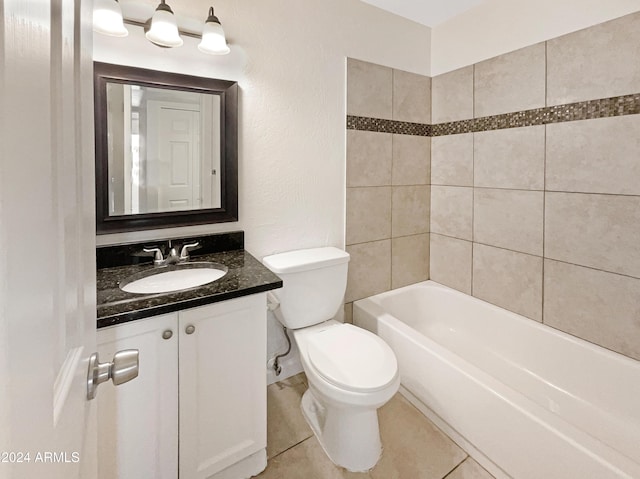 full bathroom featuring tile patterned flooring, vanity, toilet, and tiled shower / bath combo