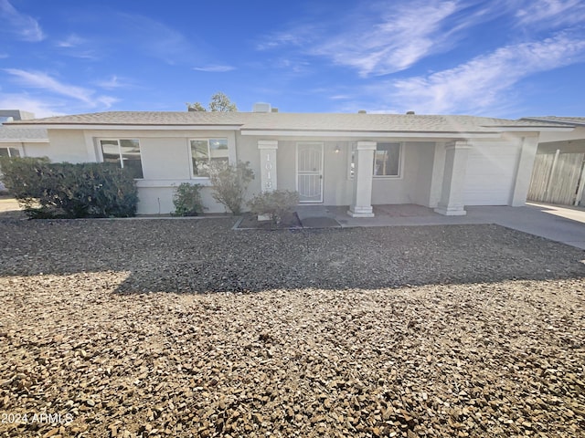 single story home featuring a garage