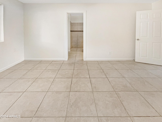 spare room featuring light tile patterned floors