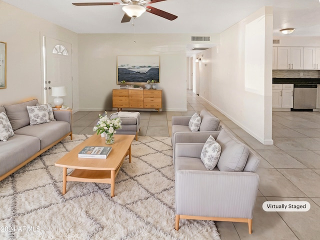 tiled living room with ceiling fan