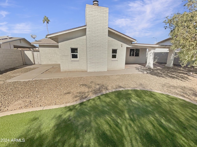 back of house featuring a patio area