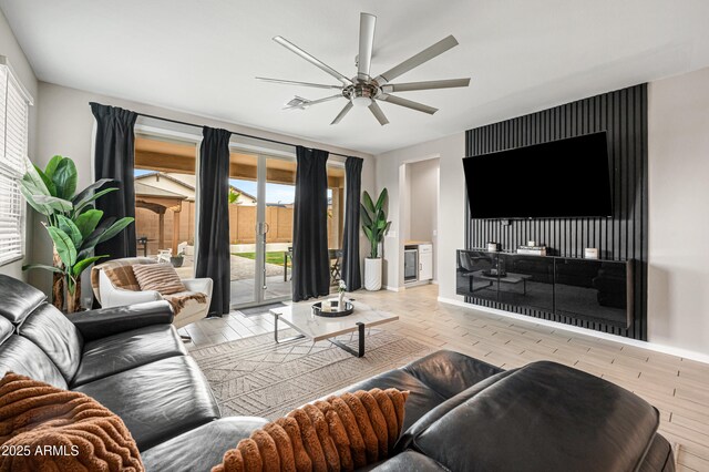 17968 W Hilton Ave, Goodyear, AZ 85338 - living area featuring ceiling fan, wood finished floors, and baseboards