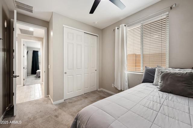 17968 W Hilton Ave, Goodyear, AZ 85338 - bedroom featuring carpet flooring, a closet, baseboards, and a ceiling fan