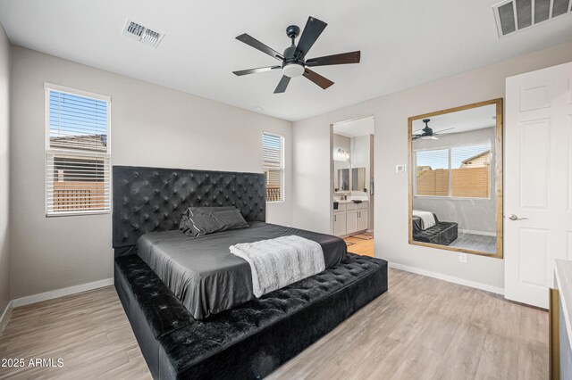 17968 W Hilton Ave, Goodyear, AZ 85338 - bedroom featuring light wood finished floors, baseboards, connected bathroom, and a ceiling fan