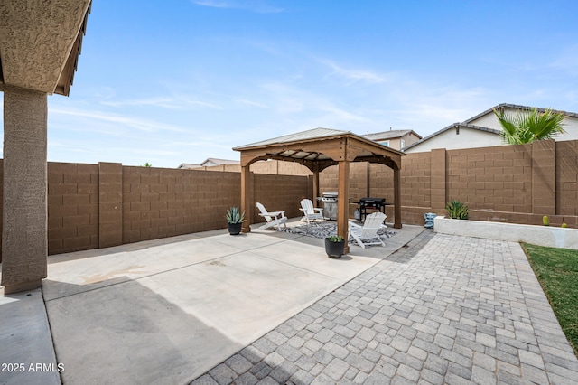 17968 W Hilton Ave, Goodyear, AZ 85338 - fenced backyard with a patio area, a gazebo, and area for grilling