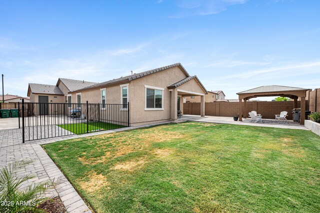 17968 W Hilton Ave, Goodyear, AZ 85338 - rear view of property with a patio area, a gazebo, and stucco siding