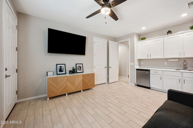 17968 W Hilton Ave, Goodyear, AZ 85338 - kitchen with baseboards, a ceiling fan, a sink, light countertops, and recessed lighting