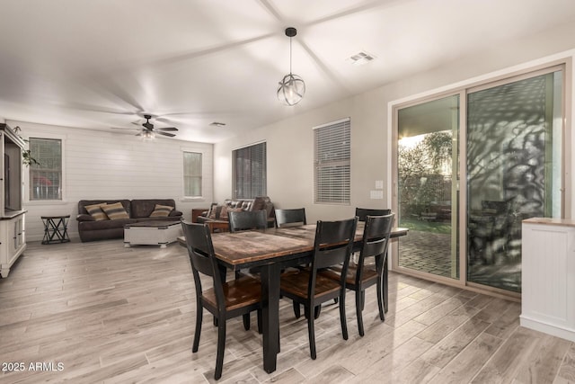 dining area featuring ceiling fan and light wood-type flooring