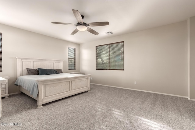 bedroom with ceiling fan and carpet flooring