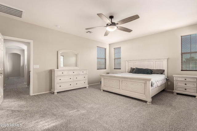 bedroom with ceiling fan and light colored carpet