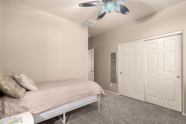 carpeted bedroom with a closet and ceiling fan