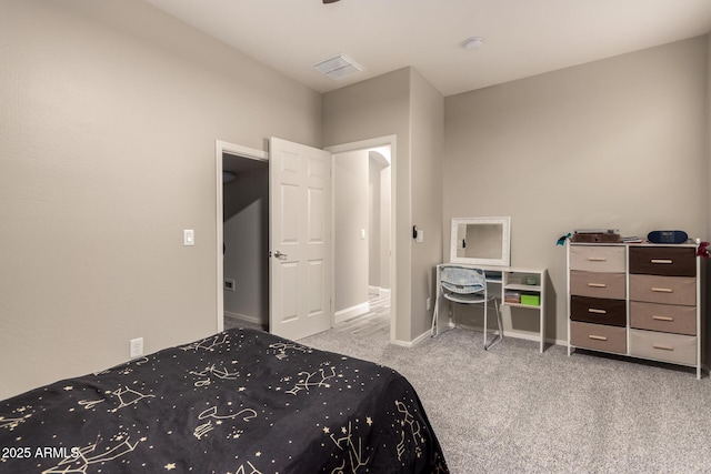 bedroom featuring light colored carpet