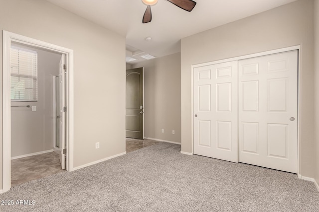 unfurnished bedroom featuring light colored carpet, a closet, and ceiling fan