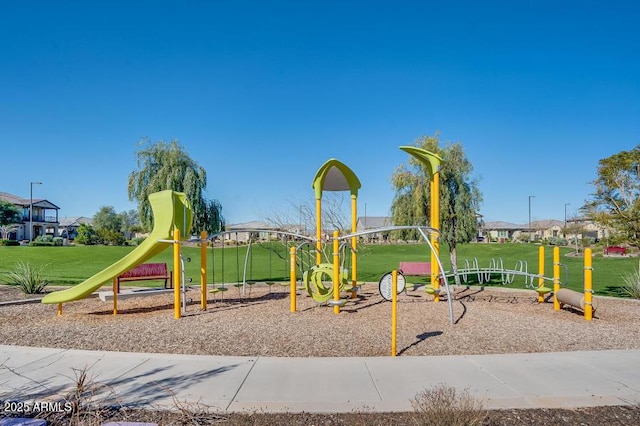 view of jungle gym with a lawn