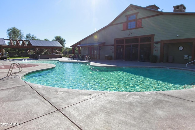 view of swimming pool featuring a gazebo and a patio