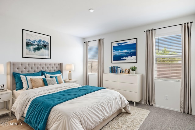 bedroom featuring light colored carpet