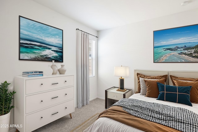 bedroom with light colored carpet