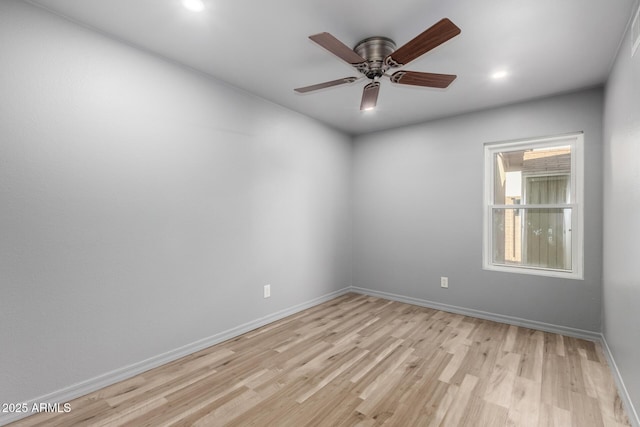 unfurnished room featuring light wood-style floors, baseboards, a ceiling fan, and recessed lighting