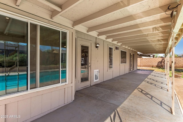 view of patio featuring fence