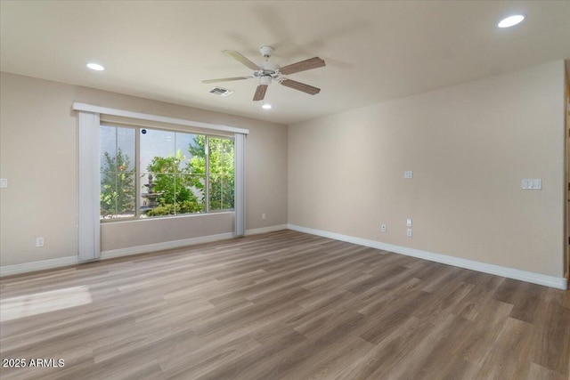 2868 E Binner Dr, Chandler, AZ 85225 - unfurnished room with a ceiling fan, recessed lighting, wood finished floors, and baseboards