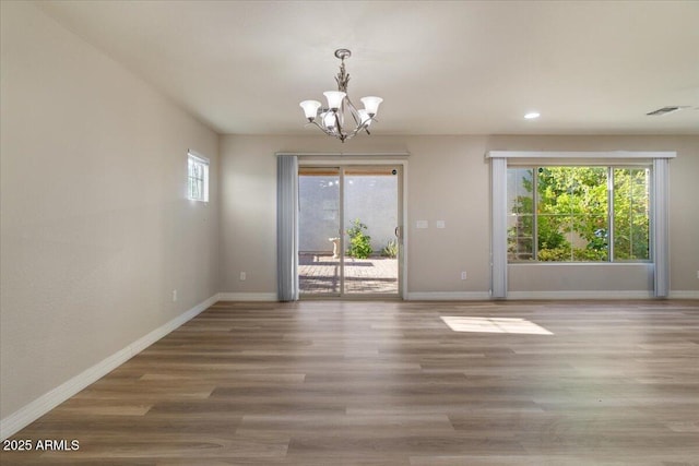 2868 E Binner Dr, Chandler, AZ 85225 - unfurnished dining area with a chandelier, baseboards, recessed lighting, and wood finished floors