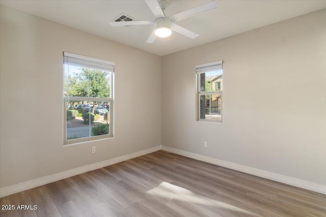 2868 E Binner Dr, Chandler, AZ 85225 - empty room featuring baseboards, wood finished floors, and a ceiling fan