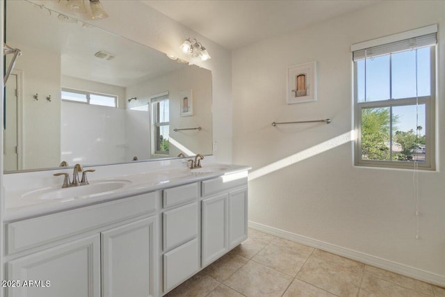 2868 E Binner Dr, Chandler, AZ 85225 - bathroom with baseboards, double vanity, and tile patterned floors