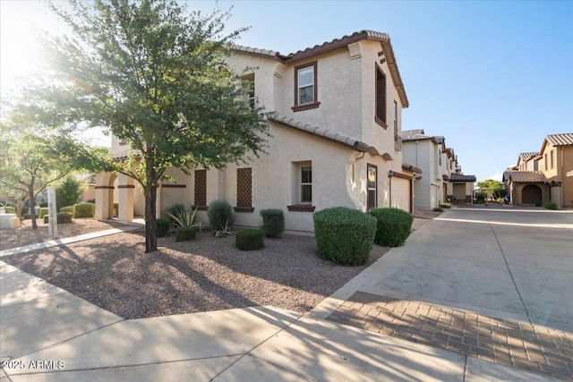 2868 E Binner Dr, Chandler, AZ 85225 - view of front of home with a tile roof, stucco siding, concrete driveway, a residential view, and a garage