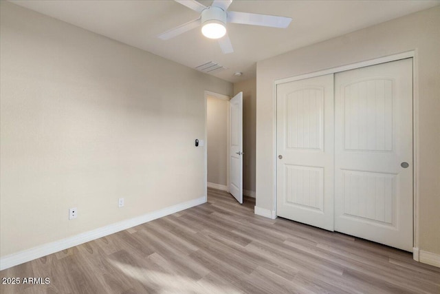 2868 E Binner Dr, Chandler, AZ 85225 - unfurnished bedroom with light wood-type flooring, baseboards, a closet, and a ceiling fan