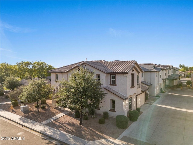 2868 E Binner Dr, Chandler, AZ 85225 - mediterranean / spanish house with an attached garage, a tiled roof, stucco siding, concrete driveway, and a residential view