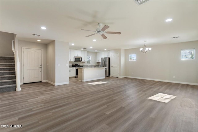 2868 E Binner Dr, Chandler, AZ 85225 - unfurnished living room with a chandelier, plenty of natural light, baseboards, and recessed lighting