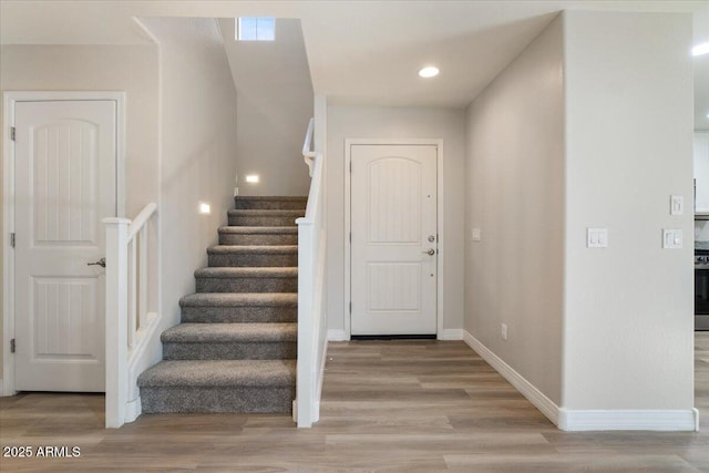 2868 E Binner Dr, Chandler, AZ 85225 - entryway with light wood finished floors, stairs, baseboards, and recessed lighting