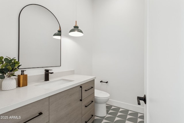 bathroom with vanity and toilet